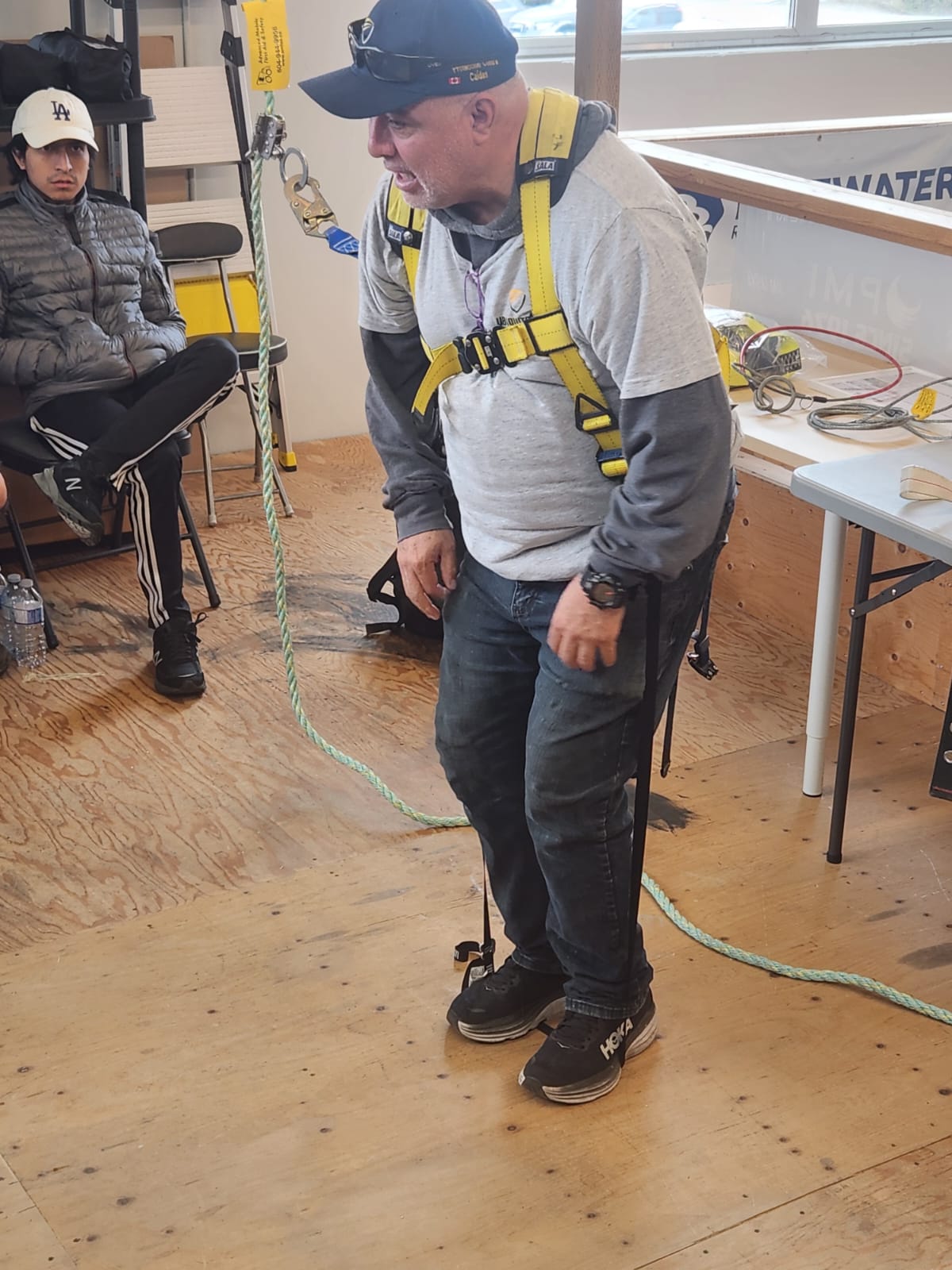 Safety instructor demonstrating proper equipment use