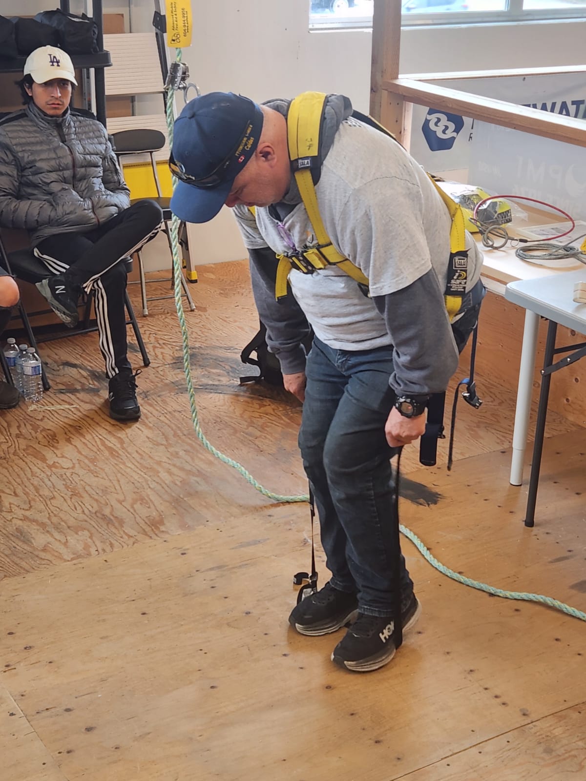 Fall protection harness training on job site